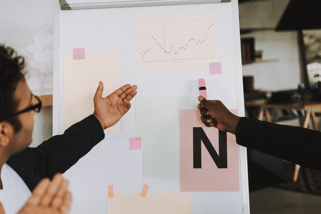 Two Afro-American Businessmen is Working in Office