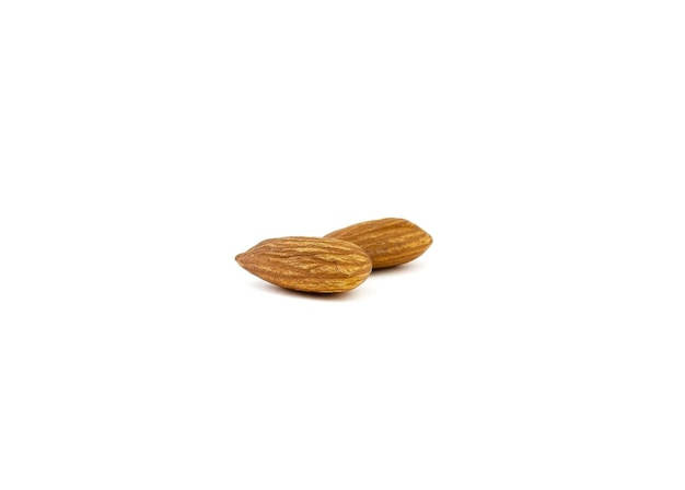 Two almond nuts isolated on a white background