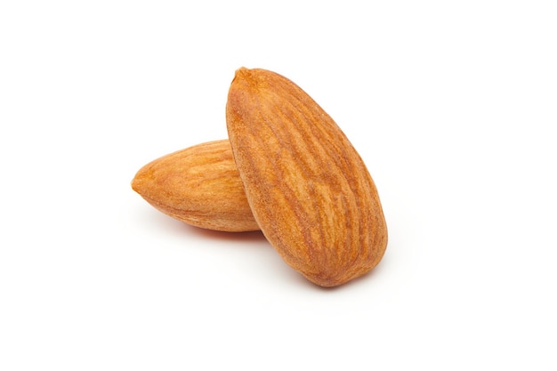 Two almond piece isolated on white background. Healthy nuts snacks. Closeup view.