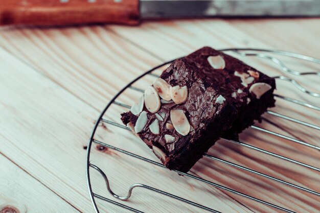 Photo two almonds brownies on a natural wood background