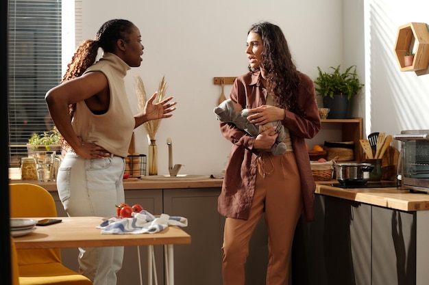 two angry women shouting at one another