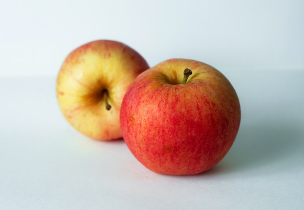 two apples with white background