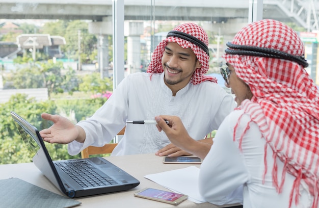 Two Arabian businessman talking agreement business contract