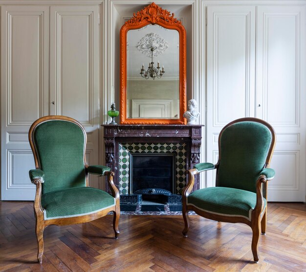 Two armchairs in front of fireplace in a living room