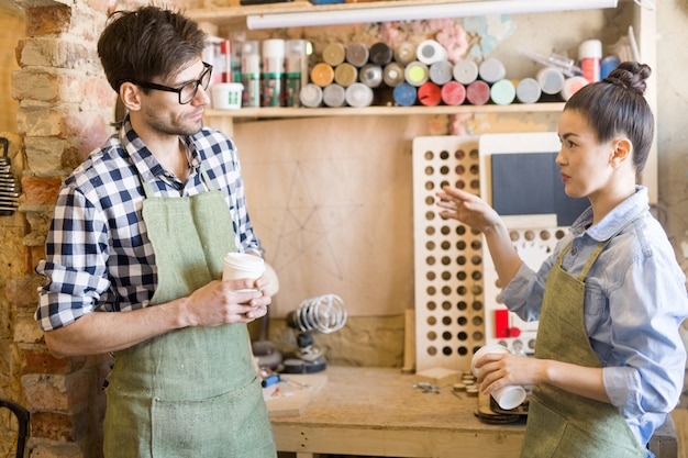 Two Artisans Taking Break from Work