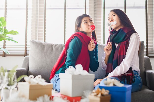 Two asian women best friends having fun together during new year