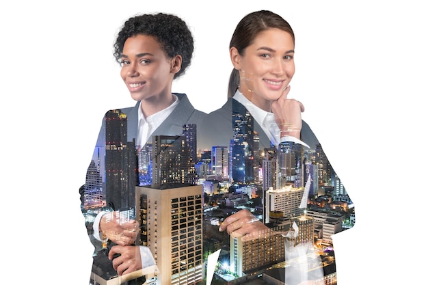 Two attractive businesswomen in suits hand on chin Asia corporate lifestyle multinational diverse young professionals Night Bangkok city view Double exposure