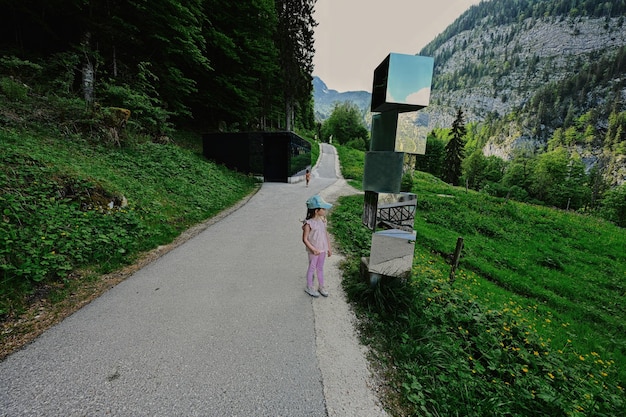 Two baby girls at path to caves at Mount Krippenstein in Hallstatt Upper Austria Europe