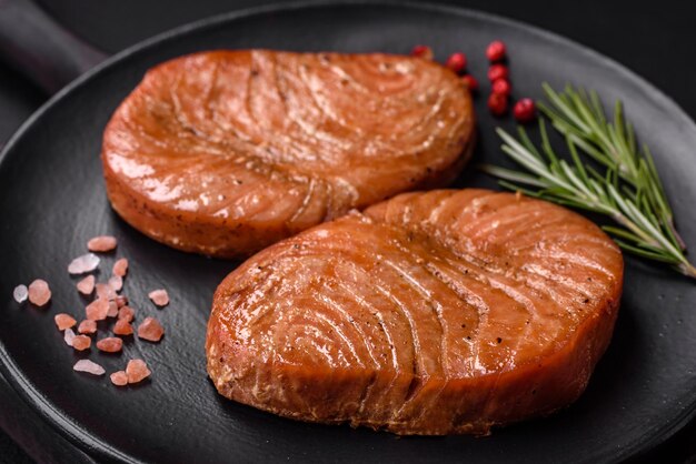 Two baked slices of tuna fillet with spices and herbs