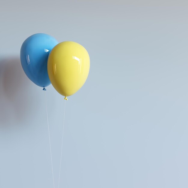 Two balloons in the colors of the flag of Ukraine with a white thread on a gray background