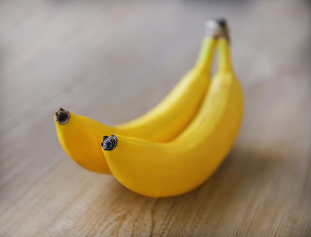 Two bananas on wooden table