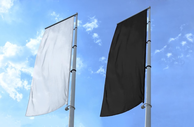 Two banner flag white and black on blue sky background