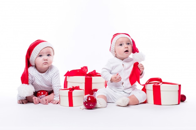 Two beautiful baby in the New Year's cap