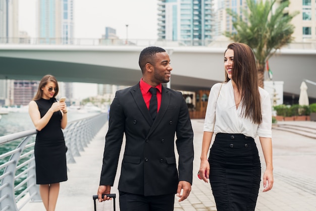 Two beautiful business woman meeting with their new college at Dubai Marine.