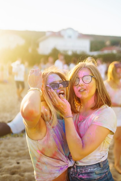 Two beautiful girls have great time on Holi festival Spring Beach Party Friendship Leisure Vacation