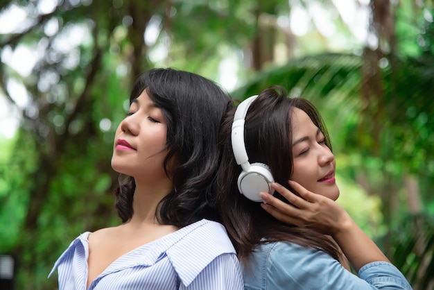 two Beautiful young woman smiling in a comfortable day.