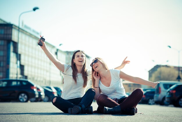 two beautiful young women dancing