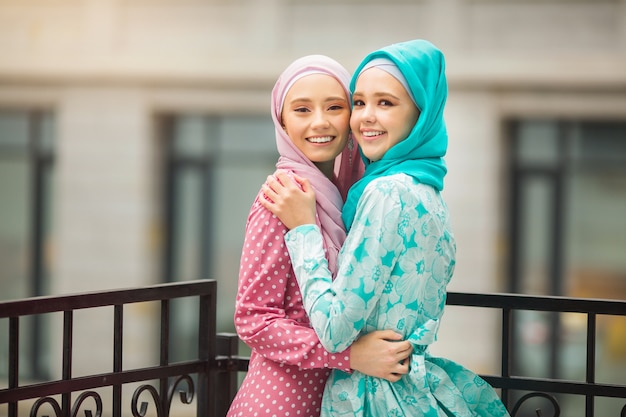 Two beautiful young women in Muslim dresses