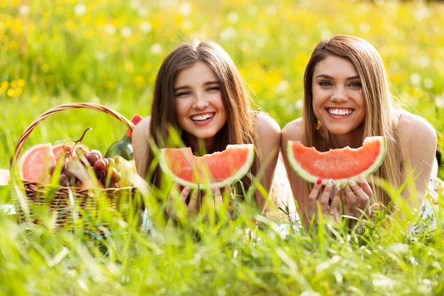 Two beautiful young women on a picnic