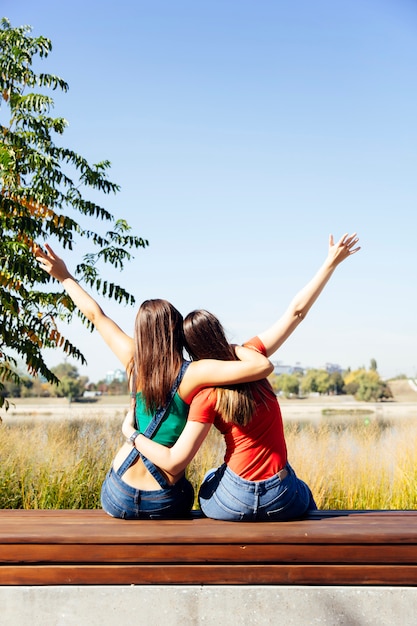 Two best female friends embracing together