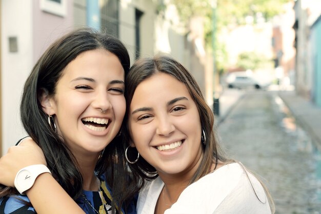 Two best friends, smiling and having fun together.