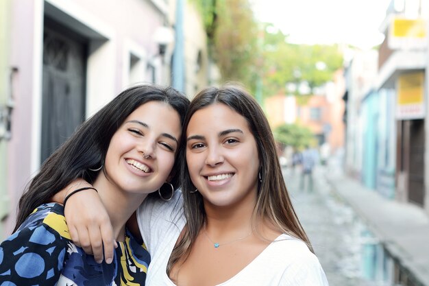 Two best friends, smiling and having fun together.