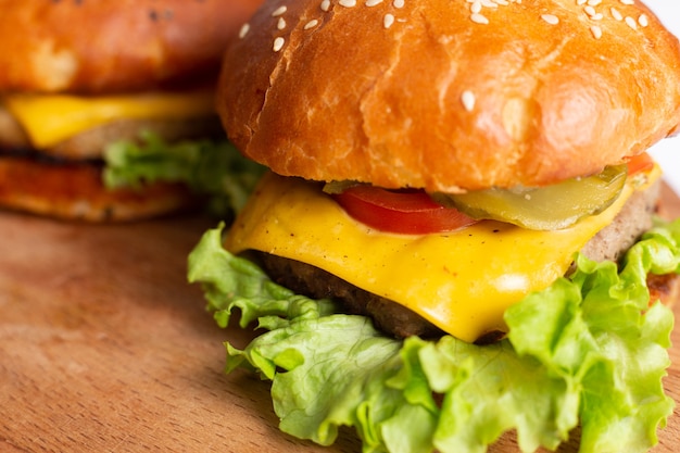 Two big hamburger on white surface