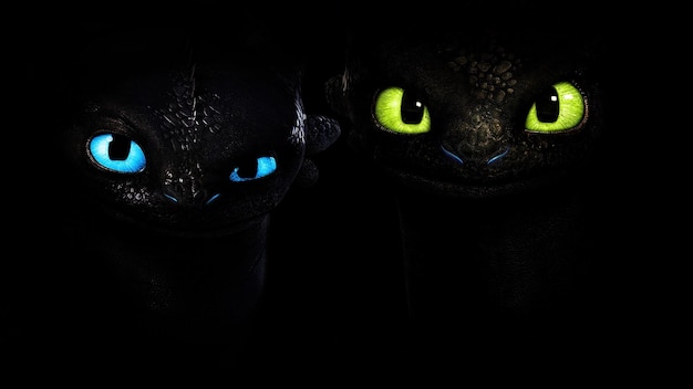 Photo two black cats with green eyes looking at the camera