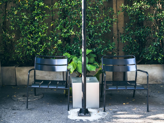 Two black chairs in smoking area