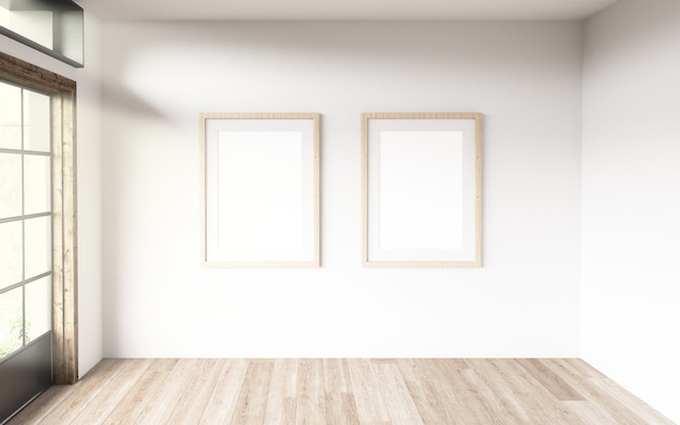 Two blanck frames in a room with large windows.