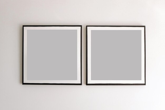 Photo two blank frame on white wall