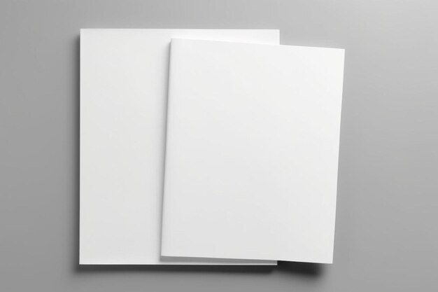 Photo two blank white papers on a gray surface