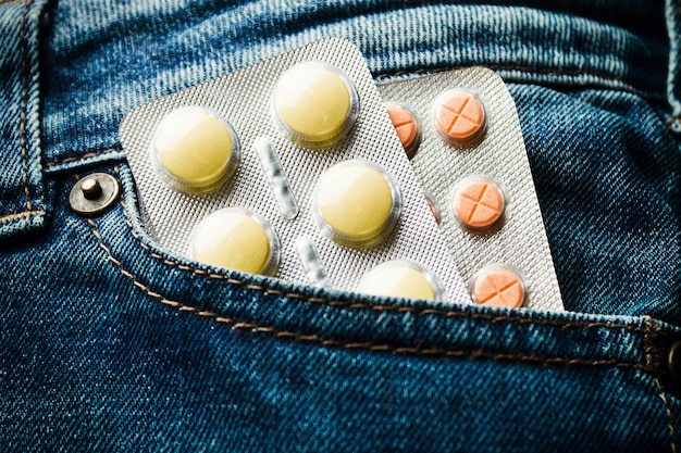 Two blister pack of pills in jeans pocket