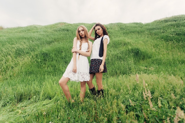 Two blonde girlfriends in hippie style