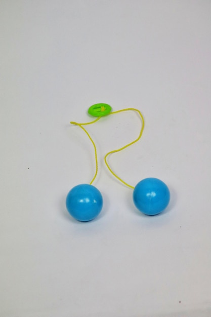 two blue balls with a yellow arrow on them