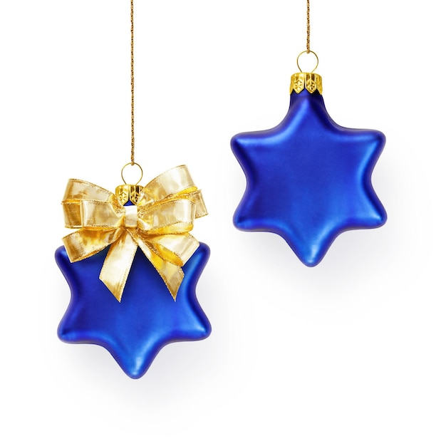 Two blue christmas stars decorated with gold bow hanging on ribbon