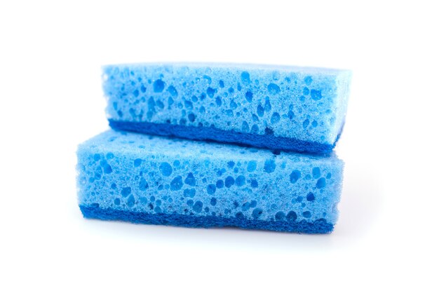 Two blue kitchen sponges isolated on white background