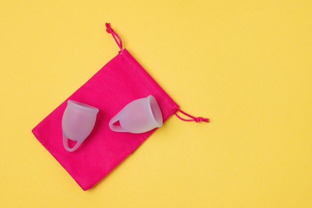 Two Blue Menstrual Cup on Pink Bag