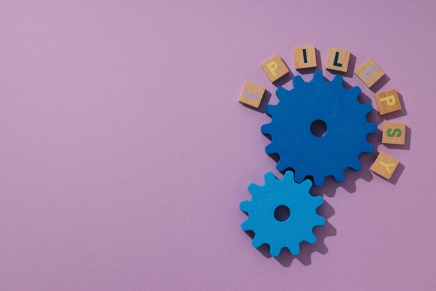 Photo two blue wooden gears epilepsy day concept