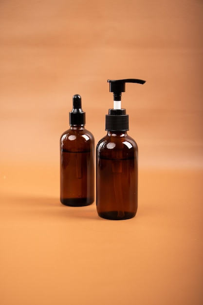 two bottles of shampoo and lotion are on a table