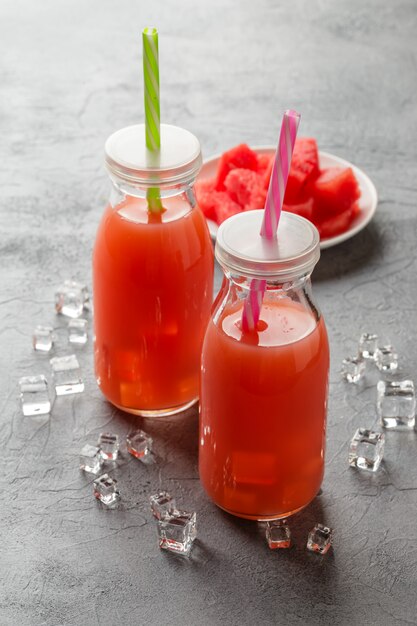 Two bottles of watermelon juice