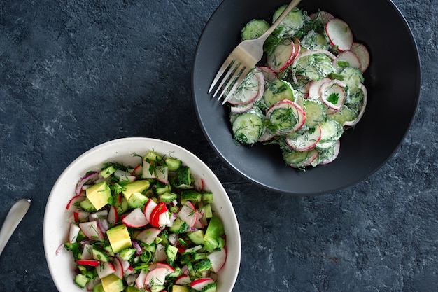 Two bowls healthy summer salad top view