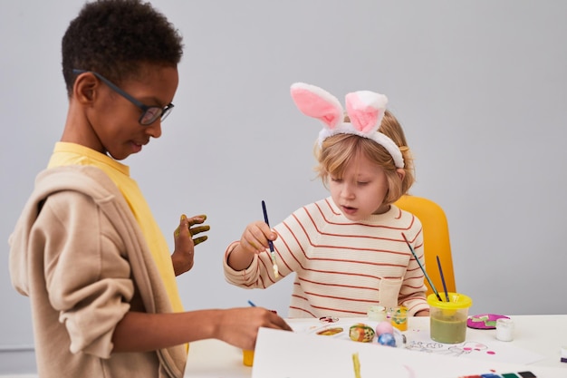 Two Boys Painting on Easter