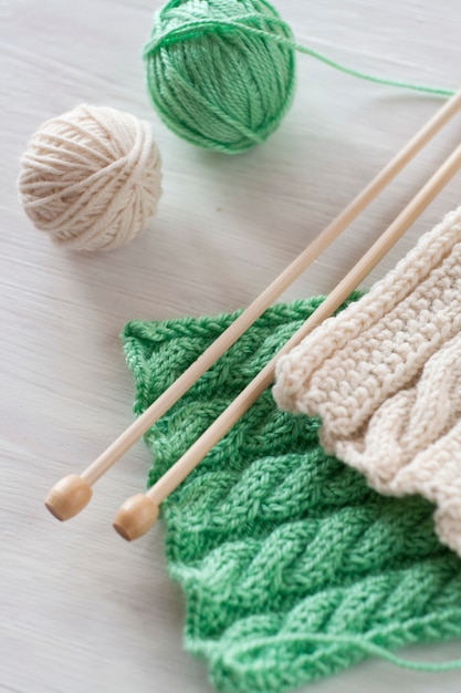 Two bright patterns and wooden knitting needles for a 