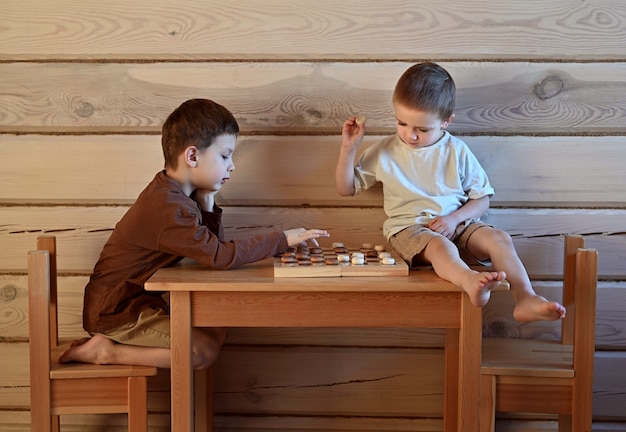 Two brothers play checkers