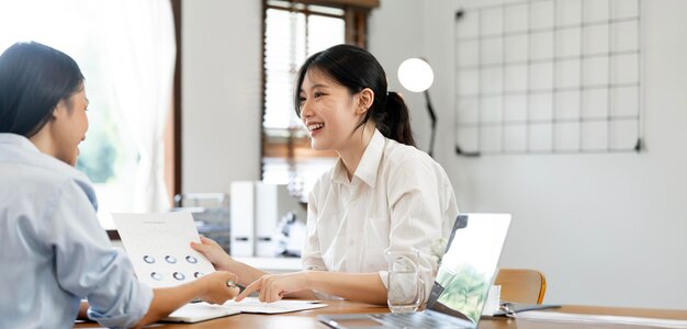 Photo two brunette business woman talking advising each other