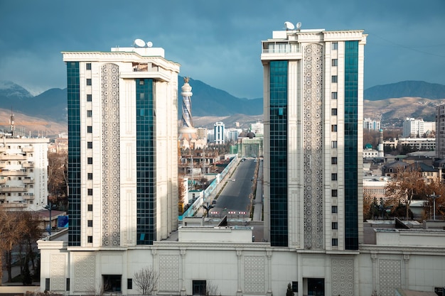 a two buildings with a view of the city in Tajikistan