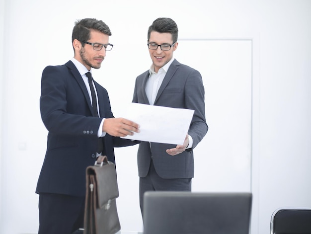 Two business people discussing a business document