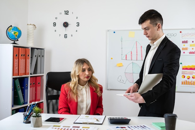 two business people discussing business documents chart report on office table Successful team analysis and strategy concept