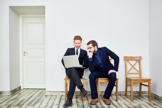 Two Business People in Waiting Room